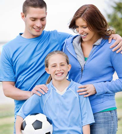 Parents supporting child in sports